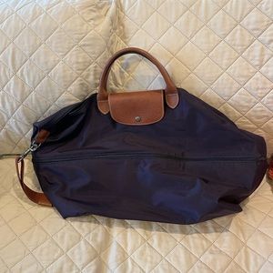 NWOT Lepliage expandable travel duffel.